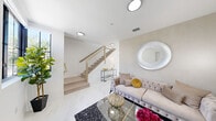 Located at 2200 E 4th Ave in Hialeah, FL, this two-story, 2-bedroom, 3-bathroom unit is thoughtfully designed with a clean, contemporary aesthetic. The main level opens into a bright living room showcasing gleaming marble-look porcelain tile floors, a sleek staircase with light wood treads and cable-style railings, and recessed lighting that keeps the space feeling airy and open. The kitchen features gray cabinetry, white quartz countertops, and stainless appliances, flowing seamlessly into the dining room and family room. A convenient half bathroom with modern vanity and natural window light completes the ground floor, which also includes patio access for outdoor living.

Upstairs, the two bedrooms are generously sized, each offering private balcony access through floor-to-ceiling sliding glass doors that invite natural light and outdoor views. The primary bedroom provides a comfortable retreat with ample closet space. A full bathroom on this level features striking marble-look wall tile surrounding the tub and shower. Throughout both floors, five closets and two hallways ensure abundant storage and easy circulation.

With a patio, two balconies, and a layout that balances communal and private spaces across two well-proportioned floors, this unit delivers a functional and refined living experience in Hialeah.