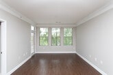 This single-floor residence at 1340–1364 Clairmont Road in Decatur, Georgia, offers a well-organized layout with distinct living, kitchen, and bathroom areas. Crown molding throughout adds a refined architectural touch, lending a polished feel to each room.

The kitchen is a standout feature, equipped with stainless steel appliances including a refrigerator, electric range, and over-the-range microwave. Light wood cabinetry pairs with granite-look countertops, and tile flooring runs underfoot. A peninsula with a sink provides additional prep space and opens the kitchen toward the adjacent living area, which benefits from track lighting and a window allowing natural light to enter.

The living area, as revealed in the floor plan scan, features wood-look flooring and flows through an open, connected layout. The bedroom is carpeted and includes a large window fitted with horizontal blinds, offering views of surrounding greenery and providing ample natural light.

The bathroom features a soaking tub with a tiled surround, brushed nickel fixtures, and a clean, neutral palette. Tile flooring completes the space with a practical and cohesive finish. Overall, the unit presents a functional and comfortable living environment in the Decatur area.