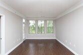 This single-floor residence at 1340–1364 Clairmont Road in Decatur, Georgia, offers a well-organized layout with distinct living, kitchen, and bathroom areas. Crown molding throughout adds a refined architectural touch, lending a polished feel to each room.

The kitchen is a standout feature, equipped with stainless steel appliances including a refrigerator, electric range, and over-the-range microwave. Light wood cabinetry pairs with granite-look countertops, and tile flooring runs underfoot. A peninsula with a sink provides additional prep space and opens the kitchen toward the adjacent living area, which benefits from track lighting and a window allowing natural light to enter.

The living area, as revealed in the floor plan scan, features wood-look flooring and flows through an open, connected layout. The bedroom is carpeted and includes a large window fitted with horizontal blinds, offering views of surrounding greenery and providing ample natural light.

The bathroom features a soaking tub with a tiled surround, brushed nickel fixtures, and a clean, neutral palette. Tile flooring completes the space with a practical and cohesive finish. Overall, the unit presents a functional and comfortable living environment in the Decatur area.