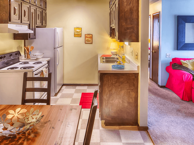 Double-Galley Kitchen with Checkered Flooring - City Limits Apartments