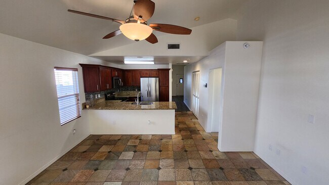 Building Photo - Single Story with large covered patio. Two car garage with uncovered gated parking stall. New vin...