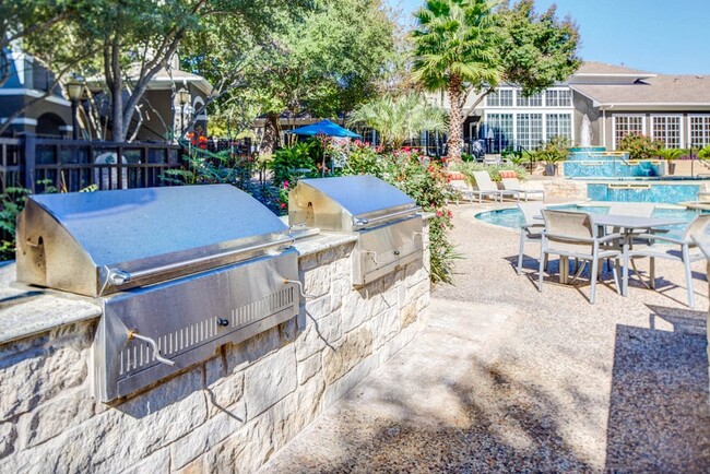 Charcoal BBQ Pits by pool and table seating - Nolina Flats