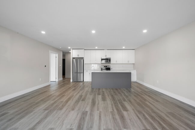 Photo du bâtiment - 1 Bedroom + Den Elation Suites - Plan B1