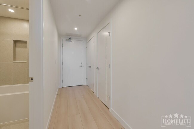 Photo du bâtiment - Stunning Brand-New 1-Bedroom Condo at Century City — Elevated Living Steps from SkyTrain