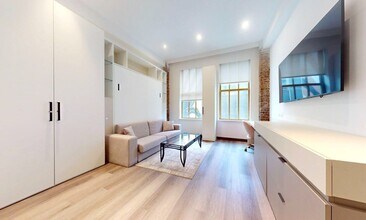 Building Photo - Open & Airy Luxury Studios