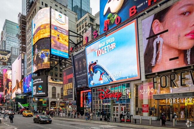 Times Square is full of bright lights and neon signs.