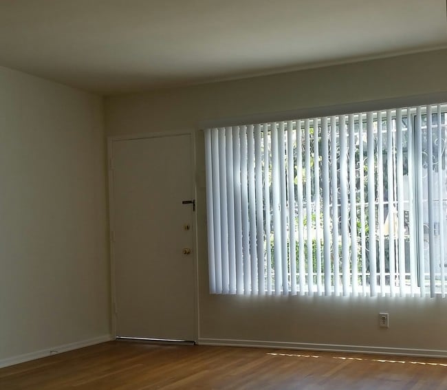front door and south facing picture window - 8663 Chalmers Dr