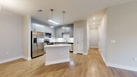 Located at 500 Liberty in Fort Walton Beach, FL, this well-appointed 3-bedroom, 2-bathroom single-story home offers a thoughtfully designed layout with modern finishes throughout. The open-concept kitchen and dining area serves as the heart of the home, featuring sleek gray cabinetry, a full suite of stainless steel appliances, a white tile backsplash, granite countertops, a central island with pendant lighting, and warm wood-look flooring that extends throughout the main living areas. The living room is bright and inviting, highlighted by French doors that allow abundant natural light and provide outdoor access. The spacious primary bedroom includes a generous walk-in closet with built-in wire shelving and plush carpet flooring, while additional bedrooms offer ceiling fans, large windows, and comfortable carpet underfoot. The bathrooms are clean and functional, with one featuring a tiled tub-surround and wood-look flooring. Two well-sized closets add practical storage throughout the home. The neutral color palette, recessed lighting, and consistent finishes create a cohesive and modern ambiance, making this home a comfortable and stylish residence in the heart of Fort Walton Beach.