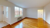 Located at 7340 Old York Rd in Elkins Park, PA, this 2-bedroom, 1-bathroom unit offers a well-organized single-floor layout with a thoughtful mix of comfort and functionality. Warm hardwood floors flow throughout the living spaces and bedrooms, reflecting natural light and adding a classic charm to the interior. The living room is bright and open, with a clean, neutral palette that provides a versatile backdrop for any décor style.

The kitchen is well-appointed with rich honey-toned wood cabinetry, dark granite-style countertops, a tile backsplash, and white appliances including a gas range, microwave, and refrigerator. Light tile flooring and a flush-mount light fixture complete the space, which also features an electrical panel conveniently integrated into the wall.

Both bedrooms are generously sized, featuring gleaming hardwood floors, large windows that invite natural light and outdoor views, and individual wall-mounted climate control units. The primary bedroom is notably spacious. With five closets spread across the unit, storage is plentiful throughout.

The bathroom is clean and functional, finished with floor-to-ceiling tile, a tub/shower combination, and a window that brings in natural light. Three hallways connect the rooms seamlessly, contributing to an efficient and easy-to-navigate floor plan.