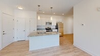 Located at 111 Sunset Cir in Camden, Delaware, this single-floor, 3-bedroom, 2-bathroom home offers a clean and modern living experience. The open-concept layout seamlessly connects the kitchen, dining area, and living room, creating an inviting communal space. The living room features light wood-look flooring, recessed lighting, and a sliding glass door that opens to a private balcony with outdoor views, allowing abundant natural light to fill the space.

The kitchen is well-appointed with white cabinetry, a subway tile backsplash, granite countertops, stainless steel appliances, a built-in island with a sink, and stylish pendant lighting. A dedicated pantry provides additional storage.

The spacious primary bedroom includes plush carpeting, a ceiling fan, and a bright window. The en-suite bathroom features a walk-in shower, while the second bathroom offers a full tub/shower combo, a white vanity, and wood-look tile flooring. The two additional bedrooms are carpeted and well-lit, each with closet access. Six closets throughout the home ensure ample storage. A hallway connects the bedroom wing to the main living areas, completing this thoughtfully designed, move-in-ready home.