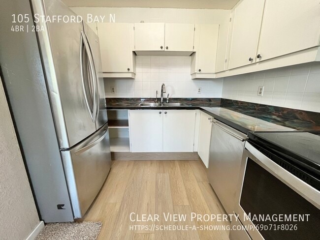 Building Photo - Perfect Fully Fenced family home in North Lethbridge with AC!!  **PROMO: 1ST HALF MONTH FREE