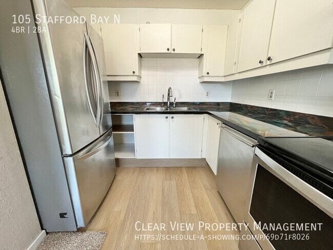 Photo du bâtiment - Perfect Fully Fenced family home in North Lethbridge with AC!!  **PROMO: 1ST HALF MONTH FREE