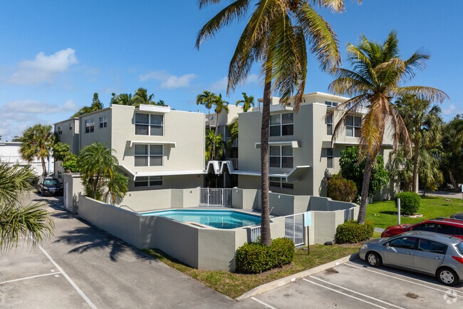 Front of the Building with Pool - The Oaks Apartments