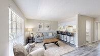 Located at 872 Bettina Ct in Houston, TX, this single-story, one-bedroom, one-bathroom home offers a thoughtfully organized layout that maximizes comfort and functionality. The living room features warm-toned hardwood-style flooring, neutral walls, and a large window that fills the space with natural light, creating an inviting and open atmosphere. Adjacent to the living area, the dining space provides a seamless transition for everyday living, with direct sightlines into the galley-style kitchen. The kitchen is well-appointed with white cabinetry running along both sides, ample countertop workspace, a double sink, and white appliances, offering a clean and practical cooking environment. The bedroom is a comfortable retreat, finished with plush carpeting, a ceiling fan, a large window with outdoor views, and access to two closets, providing generous storage. The full bathroom is finished with white subway tile in the tub-shower surround, hardwood-style flooring, and clean, bright fixtures. Throughout the home, a consistent neutral color palette, natural light, and coordinated flooring create a cohesive and welcoming ambiance suited for comfortable single-floor living in Houston.