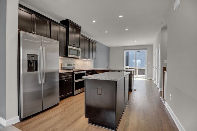 Building Photo - Luxury 4-Story Townhome with Rooftop Terrace!
