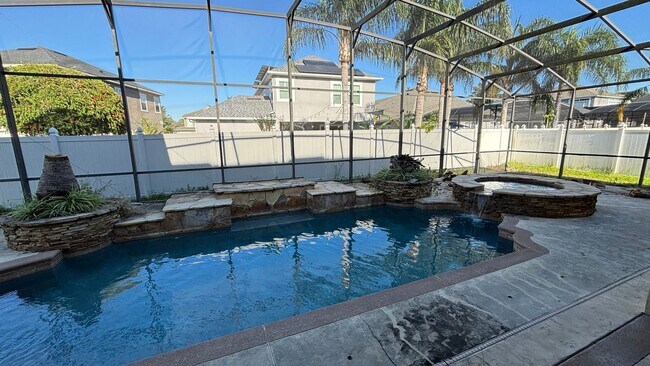 Building Photo - 4 Bedroom, 4 Bath Single Family Pool Home!