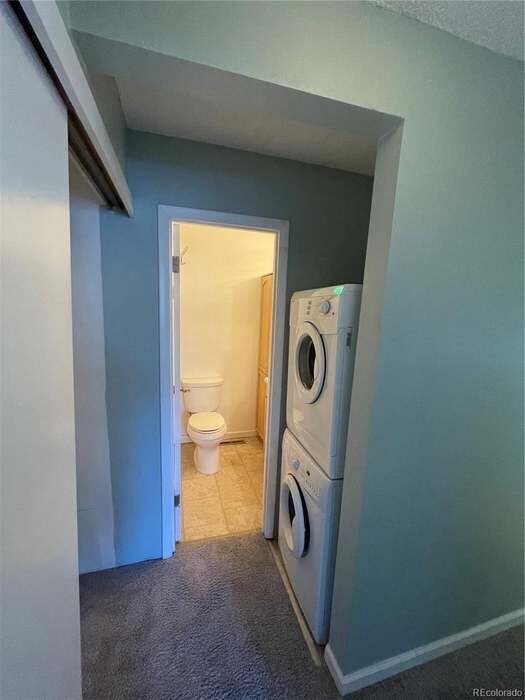 End of hallway that splits to the bedroom on one side and the bathroom, 2 hall closets, & W/D - 6700 E Mississippi Ave