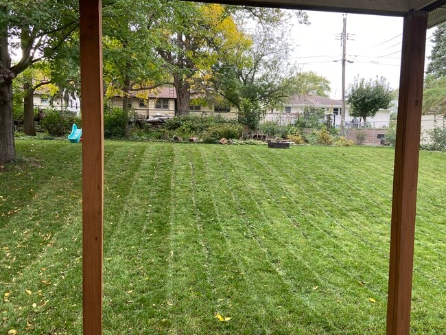 Large backyard with fire pit and plenty of wood for bonfires - 223 17th Ave N