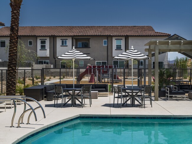 Find your oasis at Aster Ridge with our stunning pool and cozy lounge seating. Perfect for those endless Arizona summers. - Amavi Aster Ridge