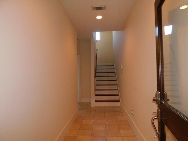 Entry and Stairs to Den and Kitchen Area - 404 Parker St