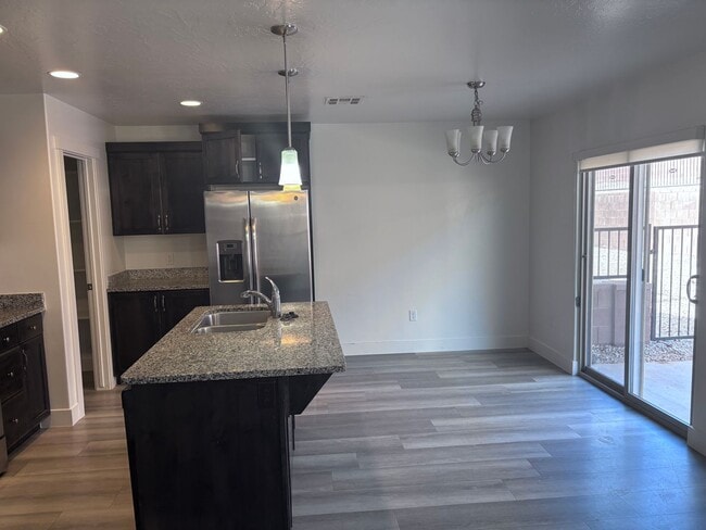 Building Photo - 4bd | 2.5 Bath | 2 Car Detached Desert Canyon Townhome Now Available