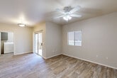 Located at 4045 W Bell Rd in Phoenix, Arizona, this single-story, 2-bedroom, 2-bathroom home offers a well-designed layout with a clean, neutral aesthetic throughout. The living room is bright and open, featuring durable wood-look flooring, a ceiling fan with light fixture, a sliding glass door that leads to an outdoor area, and a window that allows natural light to fill the space.

The kitchen is efficiently designed with gray cabinetry, granite-style countertops, a peninsula breakfast bar, and a full suite of stainless steel appliances including a refrigerator, range, microwave, and dishwasher. Wood-look flooring continues seamlessly through the kitchen and living areas.

Both bedrooms are comfortably sized, each equipped with ceiling fans and windows for natural light. The primary bedroom features a walk-in closet and plush carpeting, while the second bedroom offers wood-look flooring. Each bedroom is served by its own full bathroom, with the bathrooms featuring wood-look tile flooring, granite-style vanity countertops, gray cabinetry, and a tub/shower combination.

A dedicated in-unit laundry room accommodates a full-size washer and dryer and includes a water heater. The home's warm, neutral color palette and consistent finishes create a cohesive and functional living environment.