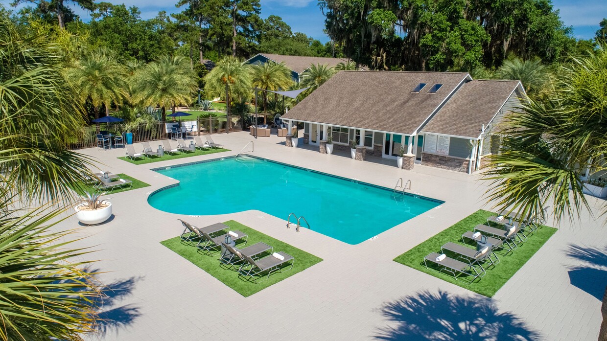 Immerse yourself in relaxation and luxury amidst the sparkling blue waters and sun-kissed loungers at our resort-style pool deck. - Emerson Isles