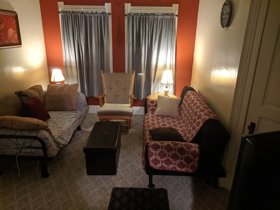 1 single and 1 double futon in living room - 402 Union St