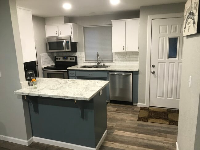 Kitchen w/front door - 12218 2nd Avenue Ct E