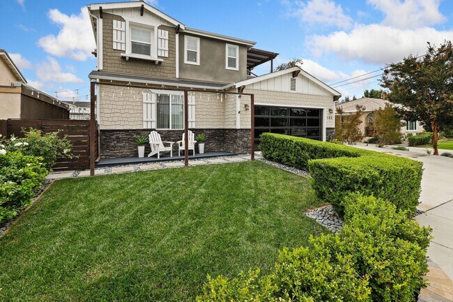 Front yard and front porch. - 185 E 19th St