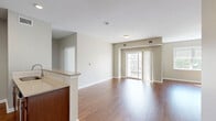 Located at 330 Jacksonville Road in Warminster, PA, this one-bedroom, one-bathroom unit offers a well-designed single-floor layout with a comfortable and functional living space. The open living room features warm hardwood-style flooring, neutral-toned walls, and a window that allows natural light to fill the room, creating a bright and welcoming atmosphere. The kitchen is efficiently designed with rich dark wood cabinetry, a classic white subway tile backsplash, stainless steel appliances including a range, over-the-range microwave, and refrigerator, as well as a peninsula with a sink that provides additional counter space and separates the kitchen from the living area. The generously sized primary bedroom is finished with plush carpeting, a ceiling fan with light fixture, and a large window that brings in ample natural light. A dedicated closet with double doors provides substantial storage. The bathroom features neutral tile flooring, a wood-toned vanity with an overhead light bar, and a clean, functional layout. Consistent neutral tones and hardwood-style floors throughout the main living areas tie the space together with a cohesive, modern aesthetic.