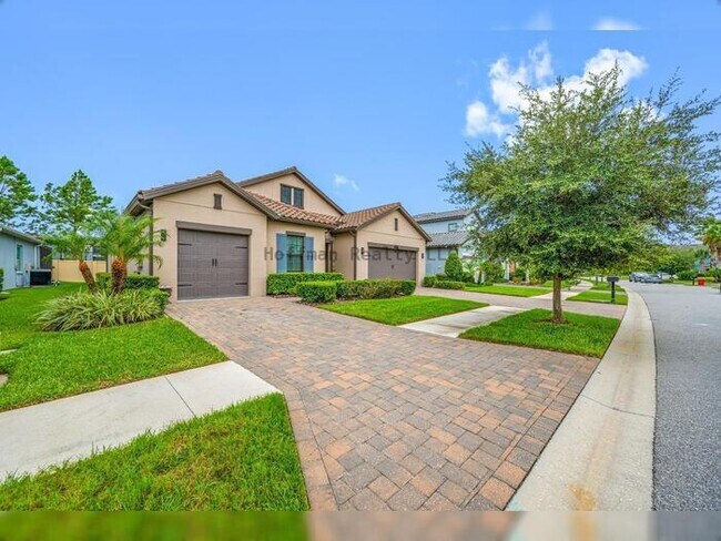 Foto del edificio - Luxury 4-Bedroom Home with 3-Car Garage in Gated Promenade at LakePark