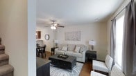 Located at 133 Boone Ridge Dr in Johnson City, Tennessee, this two-floor home offers a thoughtfully designed layout that balances comfort and functionality. The main living area greets you with warm hardwood-style flooring, neutral toned walls, and a ceiling fan that enhances the airy, welcoming atmosphere. The open floor plan seamlessly connects the living room to the dining area, creating an ideal space for both everyday living and entertaining. The kitchen is equipped with rich, warm-toned cabinetry, granite-style countertops, and a full suite of stainless steel appliances, including a side-by-side refrigerator with ice and water dispenser, an electric range, and an over-the-range microwave. Ample cabinet storage and counter space make this kitchen as practical as it is attractive. A central hallway on the upper level provides easy access to multiple bedrooms, each featuring plush carpeting, ceiling fans, and generous natural light. The bedrooms share a full bathroom fitted with a tub-shower combination and tiled flooring. Throughout the home, the design maintains a cohesive, neutral palette that provides a versatile backdrop for any décor style, making this a well-rounded and move-in ready residence.