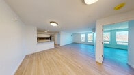 Located at 904 Farmington Ave in West Hartford, CT, this thoughtfully designed 3-bedroom, 1-bathroom unit offers a clean, modern aesthetic with light hardwood flooring flowing throughout every room. The open-concept living and kitchen area forms the heart of the unit, bathed in natural light from large windows that frame views of the surrounding landscape. The kitchen is well-appointed with white shaker cabinetry, granite countertops, a blue subway tile backsplash, stainless steel appliances including a refrigerator, range, and microwave, and a peninsula with an undermount sink — ideal for both cooking and entertaining. The spacious living area provides ample room to relax, with natural light pouring in from generously sized windows. Each of the three bedrooms features hardwood flooring, large windows with outdoor views, and closet space, including a walk-in closet with wire shelving in one bedroom and a bifold-door closet in another. A wall-mounted mini-split unit provides climate control in the primary bedroom. The full bathroom is clean and modern, featuring a white vanity with cabinet storage, a warm-toned mirror, and hardwood flooring. A utility room completes the layout, adding practical storage and functionality to this bright, move-in-ready unit.