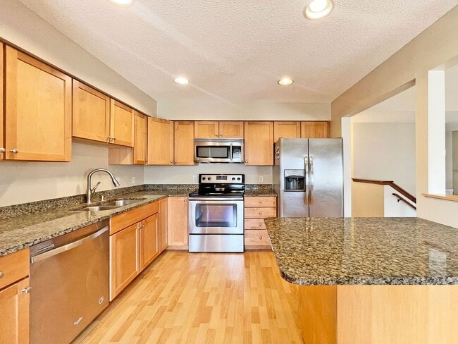 Building Photo - Beautifully Redone Modern Townhome with Large Deck, 2-Car Garage, Granite Kitchen, Vaulted Ceilin...