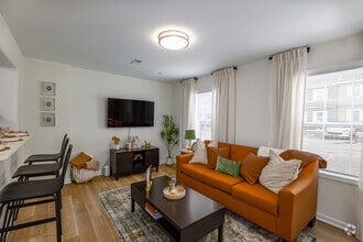 3BR, 3.5BA - 1,256SF - Living Room - The Villas at Happy Valley