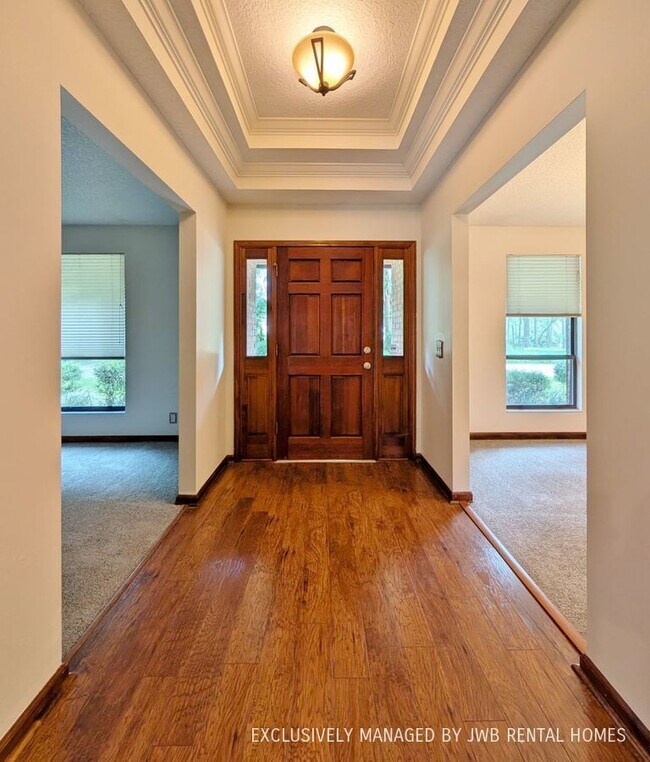 Building Photo - 6374 Whispering Oaks Dr N