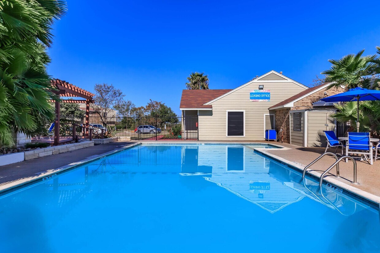 MAKE WAVES AT THE REFRESHING SWIMMING POOL - Wood Trails Apartments