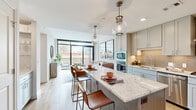 Located in Houston's desirable 77027 zip code, this thoughtfully designed one-bedroom, one-bathroom residence offers a refined living experience across a single, efficiently organized floor. The open-concept layout seamlessly connects the kitchen, living, and dining areas, creating a bright and welcoming atmosphere throughout.

The gourmet kitchen is a standout feature, boasting soft gray shaker cabinetry, a striking granite waterfall island with bar seating, stainless steel appliances including a French door refrigerator and gas range, a designer tile backsplash, and globe pendant lighting that adds a warm, contemporary touch.

The living room is bathed in natural light through expansive floor-to-ceiling windows and sliding glass doors that open onto a private balcony with open city and tree-line views. Light hardwood flooring runs throughout the main living areas, enhancing the airy, modern aesthetic.

The bedroom is a serene retreat, featuring large windows with outdoor views and plush carpeting. It connects to a spacious walk-in closet with dual hanging rods and shelving, as well as a well-appointed bathroom finished with stone-look tile flooring, a granite vanity, and a tiled walk-in shower. The overall ambiance is clean, modern, and move-in ready.