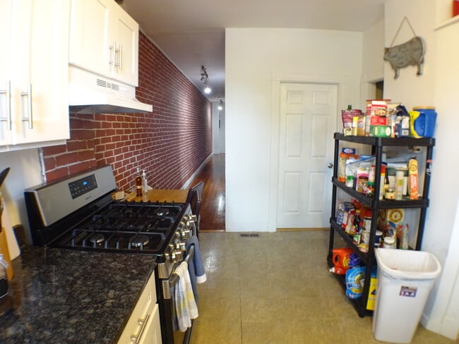 Kitchen looking back down the hallway towards the front door. - 2 Bay Street