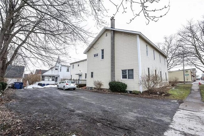 Back View w/ Parking Lot - 57 Pleasant St