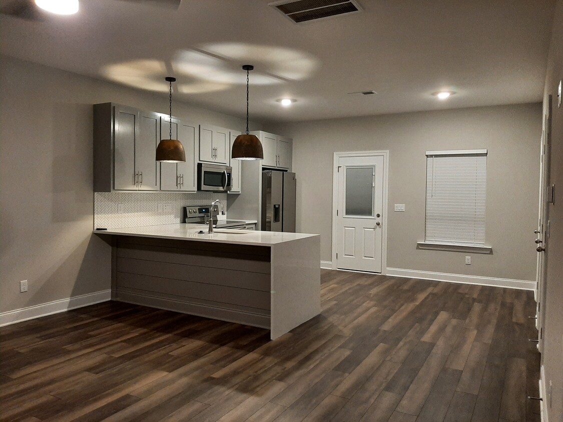 Contemporary open Kitchen with waterfall Quartz Countertop - 555 Gresham Ln