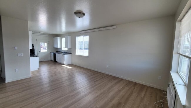 End Unit Living room looking toward kitchen. - Ammon Manchester, LLC