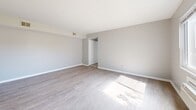 Located at 4072 Fulton Rd. in Cleveland, Ohio, this single-floor, 2-bedroom, 1-bathroom unit offers a practical and well-organized layout. The living room welcomes you with light gray luxury vinyl plank flooring, neutral-toned walls, and a wide window fitted with blinds that invites natural light and views of the surrounding neighborhood. A wall-unit air conditioner provides climate control.

The galley-style kitchen is a standout feature, showcasing crisp white cabinetry with matte black hardware, rich wood-toned butcher block countertops, a stainless steel sink, white gas range, and matching white refrigerator. White subway tile backsplash adds a clean, classic touch. An adjacent dining area benefits from its own window overlooking a tree-lined view, with the same durable plank flooring underfoot.

Both bedrooms are carpeted for comfort, each with neutral walls and ample natural light. The primary bedroom features a wide window and a wall-unit air conditioner, while the second bedroom includes built-in closet storage. The full bathroom is clean and bright, featuring a white tiled tub surround and a window for natural ventilation. A connecting hallway ties all rooms together efficiently in this compact yet functional home.