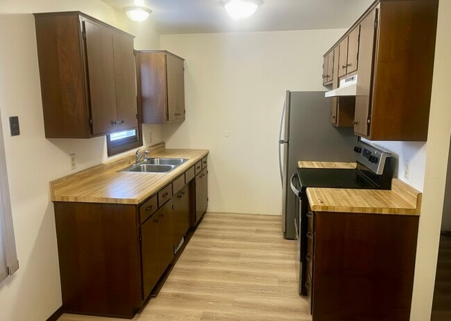 Kitchen with stainless appliances - 805 E Cedar Ave