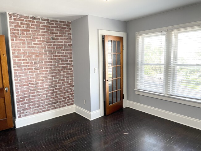Master Bedroom with Exposed Brick! - 249 E Jenkins Ave