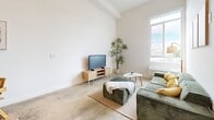 Located in East Los Angeles on E 6th Street, this two-floor home offers a thoughtfully designed layout spread across a spacious main level and a private upper-level bedroom. The main floor encompasses the living, dining, and kitchen areas, along with a full bathroom. Polished concrete floors run throughout the main level, lending an industrial-modern character to the space. The kitchen is outfitted with warm wood-grain cabinetry, a stainless steel range, a built-in hood vent, and clean white countertops — combining both style and function. A sleek, space-saving steel staircase connects the main floor to the upper level, serving as a striking architectural focal point. The living area is bright and open, featuring a large window that invites natural light and offers city views, with ample wall space ideal for personalization. The bathroom is clean and minimal, featuring a glass-enclosed shower with tile surround and polished fixtures. Upstairs, the private bedroom features light wood flooring, white walls, and a calm, restful atmosphere — providing a distinct separation from the main living areas. Throughout the home, the design balances modern minimalism with warm natural materials, creating a cohesive and functional living environment.