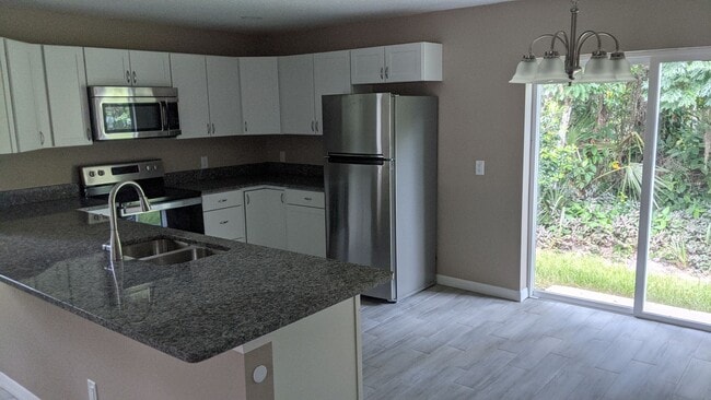 Building Photo - HALF OFF 1st MONTHS RENT - Ask about our M...