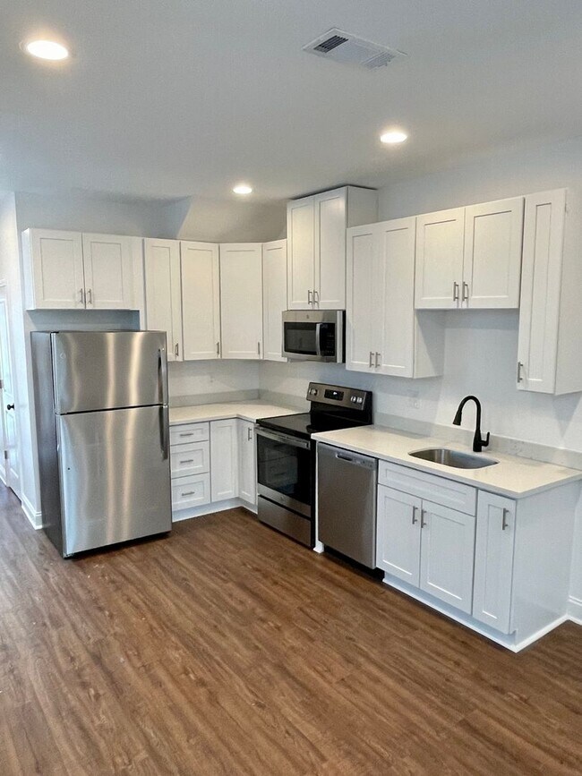 Photo - Newly Renovated 2BD/2.5BA with covered Driveway and Backyard Townhome
