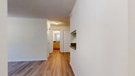 This 670 square foot apartment in Nashville, TN offers a thoughtful blend of comfort and functionality. The single-story layout encompasses one bedroom, two bathrooms, and an open-concept living area. The primary bedroom, measuring 170 square feet, provides ample space for rest and relaxation.

Throughout the apartment, warm wood-look flooring creates a cohesive and inviting atmosphere. The kitchen boasts light wood cabinetry, contrasting black appliances, and granite countertops, offering both style and practicality. The open design seamlessly connects the kitchen to the living area, ideal for entertaining or everyday living.

The bathrooms feature modern fixtures, including a tub-shower combination in at least one, ensuring versatility for different preferences. Large closets with white paneled doors provide generous storage options. The living area benefits from natural light through French doors, leading to an outdoor space.

Ceiling fans in the bedroom and living area help maintain comfort, while the textured ceilings add subtle visual interest. The neutral color palette of whites and creams allows for easy personalization. A utility room adds convenience for laundry and additional storage needs.

Located at 501 Shadowood Drive, this apartment combines modern amenities with a prime Nashville location, making it an attractive option for those seeking a contemporary urban living experience.